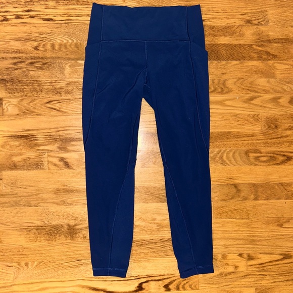 Lululemon navy leggings w/ laser cut design down sides - Picture 1 of 10